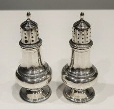 A pair of sterling silver salt and pepper shakers made by Gorham Manufacturing Co. No.SS141