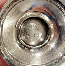 A pair of sterling silver salt and pepper shakers made by Gorham Manufacturing Co. No.SS141