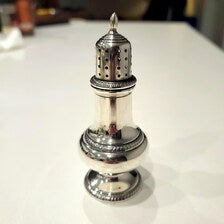 A pair of sterling silver salt and pepper shakers made by Gorham Manufacturing Co. No.SS141