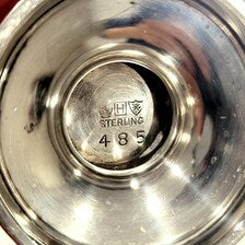 A pair of sterling silver salt and pepper shakers made by Gorham Manufacturing Co. No.SS141