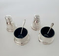 Birks, a famous Canadian brand, sterling silver salt and mustard bottle set with cobalt blue glass lining. No. SS081