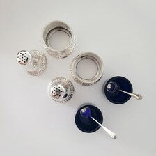 Birks, a famous Canadian brand, sterling silver salt and mustard bottle set with cobalt blue glass lining. No. SS081
