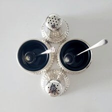 Birks, a famous Canadian brand, sterling silver salt and mustard bottle set with cobalt blue glass lining. No. SS081